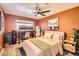 Bedroom with a large desk and workspace, a comfortable bed, and soothing, warm color scheme at 7333 E Palm Ln, Scottsdale, AZ 85257