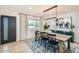 Stylish dining room features a large wooden table, seating for eight, and modern lighting fixtures at 7333 E Palm Ln, Scottsdale, AZ 85257