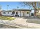 Inviting single-story home with a stylish carport, drought-resistant landscaping, and appealing curb appeal at 7333 E Palm Ln, Scottsdale, AZ 85257