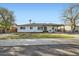 Charming single-story home features a neatly maintained front yard with new gravel and minimalist xeriscaping at 7333 E Palm Ln, Scottsdale, AZ 85257