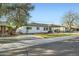 Charming single-story home featuring a neatly maintained front yard with new gravel and minimalist xeriscaping at 7333 E Palm Ln, Scottsdale, AZ 85257