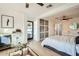 A bright main bedroom features a wet bar, sliding door closet, and ensuite bathroom at 7333 E Palm Ln, Scottsdale, AZ 85257