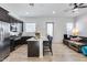 Modern open kitchen with stainless steel appliances, a large island, and seating at 7694 W Desert Spoon Dr, Peoria, AZ 85383