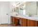 Double sink bathroom with a large mirror at 7737 W Cherry Hills Dr, Peoria, AZ 85345