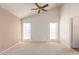 Bedroom features carpet, a ceiling fan, and multiple windows with blinds at 7737 W Cherry Hills Dr, Peoria, AZ 85345