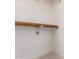 Image of a closet with a shelf and a clothes rod against a white wall and beige carpet at 7737 W Cherry Hills Dr, Peoria, AZ 85345