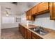 Spacious kitchen area with an island breakfast bar and tile flooring at 7737 W Cherry Hills Dr, Peoria, AZ 85345