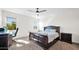 Cozy bedroom with a ceiling fan, carpeted floor, and natural light at 7751 W Forest Grove Ave, Phoenix, AZ 85043