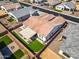 Aerial view of backyard featuring green artificial turf, covered patio, and desert landscaping at 8009 W Northview Ave, Glendale, AZ 85303