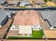 This aerial view showcases a private backyard with a covered patio and verdant lawn, perfect for relaxation at 8009 W Northview Ave, Glendale, AZ 85303