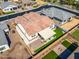 An aerial view highlighting the home's backyard with patio, artificial turf, and privacy fence at 8009 W Northview Ave, Glendale, AZ 85303