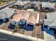 Real estate aerial view of a single-Gathering home featuring a tile roof and well-kept landscaping at 8009 W Northview Ave, Glendale, AZ 85303