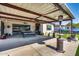 Backyard with covered patio, heaters, and desert landscape mural at 8009 W Northview Ave, Glendale, AZ 85303