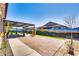 Beautiful backyard offers covered patio with desert-themed mural on the fence and lovely landscaping at 8009 W Northview Ave, Glendale, AZ 85303