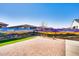 Spacious backyard features a desert-themed mural along the fence and low-maintenance landscaping at 8009 W Northview Ave, Glendale, AZ 85303