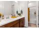 Bathroom featuring double vanity sinks, ample counter space, and a shower-tub combo at 8009 W Northview Ave, Glendale, AZ 85303