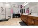 Dual sink bathroom featuring tile flooring, vanity lighting, and a shower at 8009 W Northview Ave, Glendale, AZ 85303