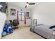 Bright bedroom featuring carpet, a ceiling fan, a desk, and decor at 8009 W Northview Ave, Glendale, AZ 85303