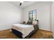 Inviting bedroom featuring soft carpet, a comfortable bed, and a window for natural illumination at 8009 W Northview Ave, Glendale, AZ 85303