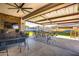 A covered patio with dining set and seating area at 8009 W Northview Ave, Glendale, AZ 85303