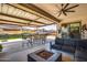 Spacious covered patio with dining and seating areas at 8009 W Northview Ave, Glendale, AZ 85303