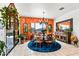 Bright dining room with vibrant accent wall, stylish chandelier, and elegant wood furniture at 8009 W Northview Ave, Glendale, AZ 85303