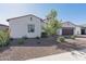 A beautiful single-story home with desert landscaping, accentuating the architectural details at 8009 W Northview Ave, Glendale, AZ 85303