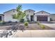 Charming single-story home featuring a well-maintained yard, desert landscaping, and a spacious two-car garage at 8009 W Northview Ave, Glendale, AZ 85303