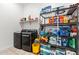 Laundry room with gray washer and dryer, shelving, and tile floors at 8009 W Northview Ave, Glendale, AZ 85303