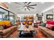 Expansive living room featuring plush seating and an open layout connecting to the kitchen for seamless entertaining at 8009 W Northview Ave, Glendale, AZ 85303