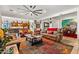 Spacious living room featuring tile floors, a ceiling fan, recessed lights, and cozy furniture at 8009 W Northview Ave, Glendale, AZ 85303