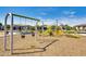 A spacious playground featuring modern swings and a climbing structure for recreational enjoyment at 8009 W Northview Ave, Glendale, AZ 85303