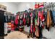 A walk-in closet filled with clothes, shoes, and shoeboxes at 8009 W Northview Ave, Glendale, AZ 85303