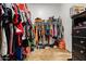 A walk-in closet that is full of clothing and shoes at 8009 W Northview Ave, Glendale, AZ 85303