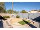 Well-maintained backyard features decorative rock, BBQ and privacy fence at 8126 E Billings St, Mesa, AZ 85207