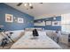 Cozy bedroom with blue accent wall and beach-themed decor, offering a relaxing atmosphere at 8126 E Billings St, Mesa, AZ 85207