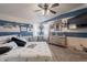 Beach-themed bedroom with ceiling fan, unique wall decor, and cozy accents at 8126 E Billings St, Mesa, AZ 85207