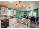 Bright kitchen boasts colorful walls, center island, and pendant lighting at 8126 E Billings St, Mesa, AZ 85207