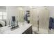 Sleek bathroom with a glass-enclosed shower, elegant fixtures, and modern design at 8149 E Petunia Ave # 1041, Mesa, AZ 85212