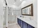 Modern bathroom with double sinks, marble tile, a glass-enclosed shower, and elegant fixtures at 8180 E Shea Blvd # 1038, Scottsdale, AZ 85260