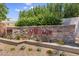 Stone community entrance with attractive landscaping and signage, creating a welcoming first impression for visitors at 8180 E Shea Blvd # 1038, Scottsdale, AZ 85260