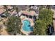 Aerial view of a community pool surrounded by lush greenery, showcasing the tranquil and luxurious amenities of the property at 8180 E Shea Blvd # 1038, Scottsdale, AZ 85260