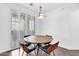 Contemporary dining area with modern table and shuttered windows at 8180 E Shea Blvd # 1038, Scottsdale, AZ 85260