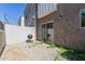 A gravel-covered backyard features a small patio space, a grill, and a view of the neighboring home at 8188 N 22Nd Dr, Phoenix, AZ 85021