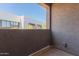 The balcony features a view of nearby buildings and desert landscaping at 8188 N 22Nd Dr, Phoenix, AZ 85021