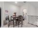 Cozy dining area with dark wood table, tile floors, and view into laundry, perfect for Gathering meals at 8188 N 22Nd Dr, Phoenix, AZ 85021