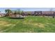 Expansive green space with lush grass, trees, and an LA Fitness in the background at 8188 N 22Nd Dr, Phoenix, AZ 85021