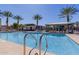 Resort-style pool with palm trees, lounge chairs and clear blue skies at 8188 N 22Nd Dr, Phoenix, AZ 85021