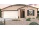 Charming single-story home with a two-car garage and desert landscaping at 8680 W Mission Hills Dr, Arizona City, AZ 85123