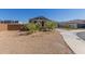 Single-story home with desert landscaping, a driveway, and a brick fence at 9313 S 39Th Dr, Laveen, AZ 85339